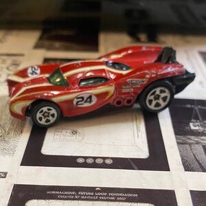 Speedy Red Toy Car with Racing Stripes